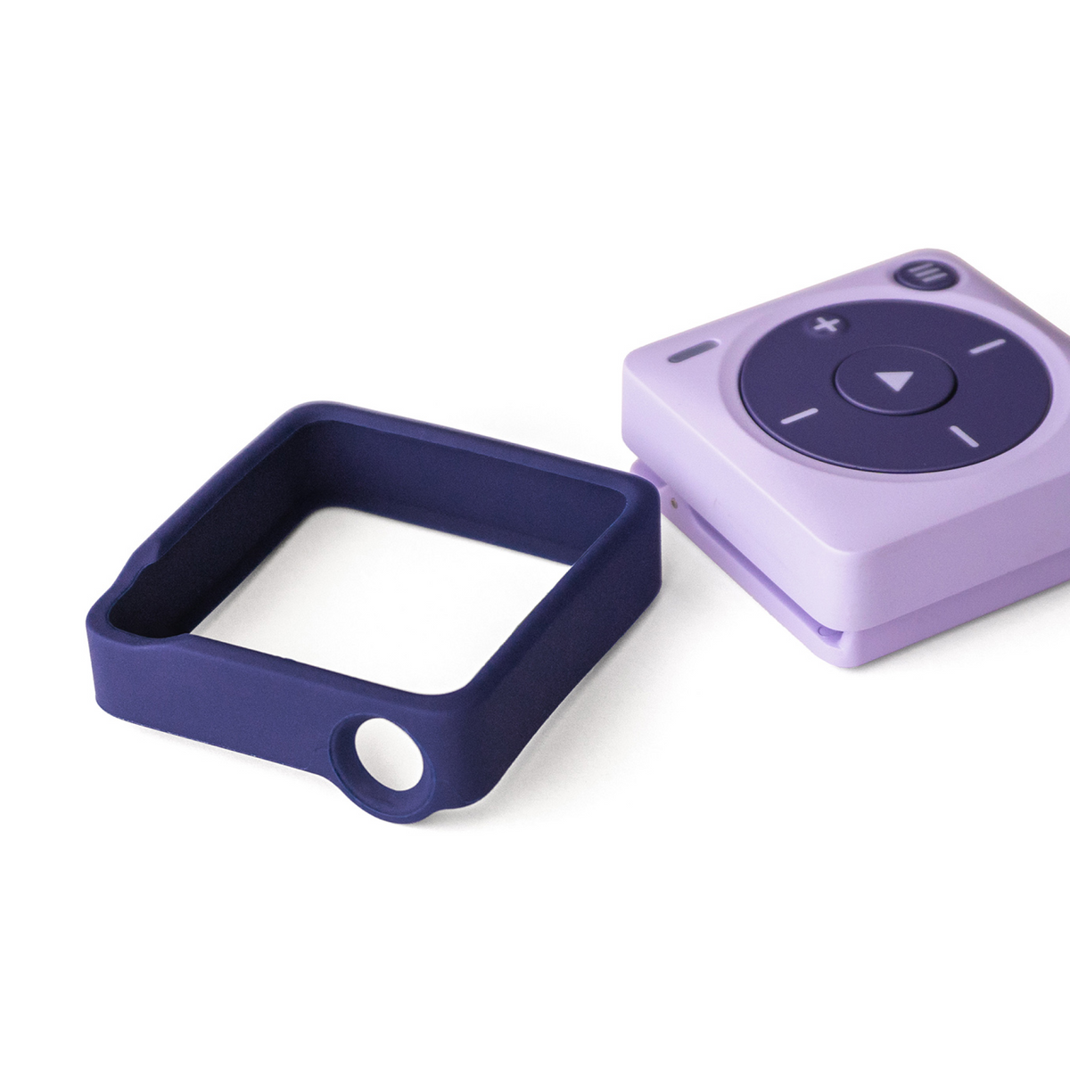 A purple protective silicone bumper for a lavender Mighty 3 device, shown with the case removed and displayed as a separate square frame.