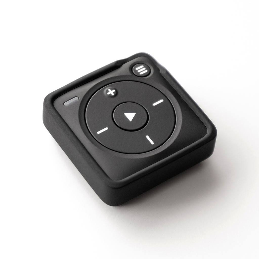 A square-shaped Mighty 3 portable media player with a black silicone outer shell pictured on a black colored Mighty 3. Shown: faceplate, featuring a directional pad, play/pause button, and volume controls - no screen.